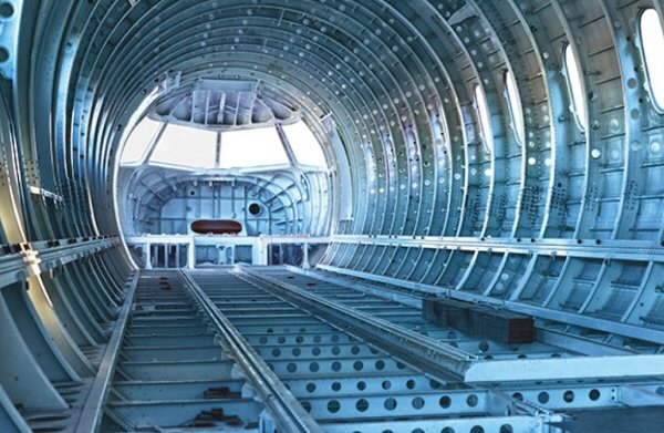 Aircraft fuselage structure showing titanium applications in aerospace manufacturing